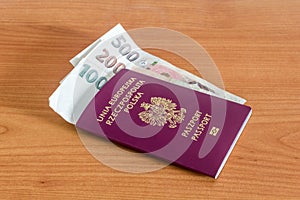 Polish biometric passport with Czech koruna banknotes CZK