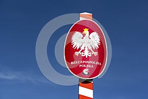Polish crest on Trojmezi point, the border between Czech Republic, Slovakia and Poland againt beautiful blue sky