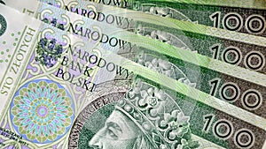 Polish currency banknotes, paper money background. Polish zloty, currency closeup. PLN 100