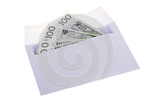 Polish currency in the envelope over white.