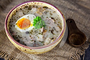 Polish easter soup with eggs and white sausage