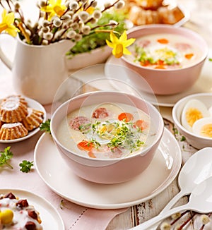 Polish Easter soup, white borscht with the addition of white sausage and a hard boiled egg. Traditional Easter dish in Poland