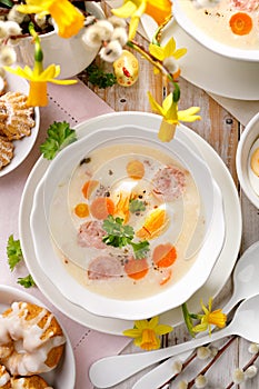 Polish Easter soup, white borscht with the addition of white sausage and a hard boiled egg. Traditional Easter dish in Poland