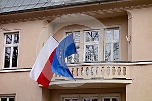Polish and European Union flags on a building which serves as consulate
