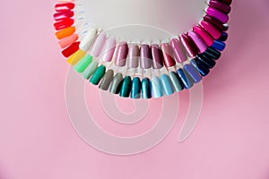Polish for Fashion manicure. Shiny gel lacquer.Nail art design wheel. Colorful cats eye nail lacquer in tips isolated