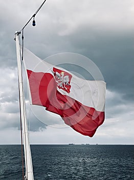 A Polish Flag flying proudly over the Baltic Sea near Hel, Poland