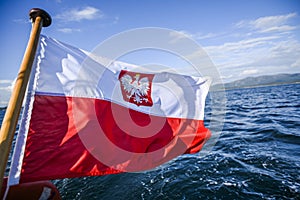 Polish flag waving while sailing on a yacht in the north sea