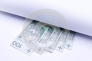 Polish money, banknotes under roll of paper