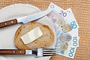 Polish money on kitchen table, coast of living