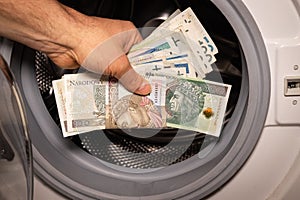 Polish money thrown into the washing machine, Concept, Money laundering, Illegal activity proceeds, Dark business, Black market,