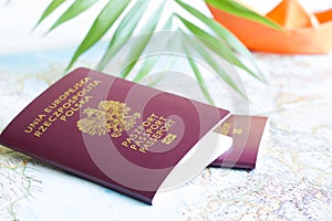 Polish passport and holiday travel vacation concept with map and paper boat