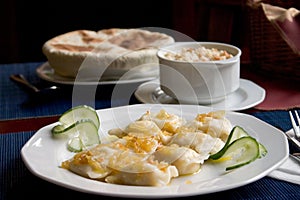 Polish pierogi and Italian soup photo