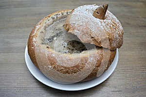Polish soup Zurek served in the bread