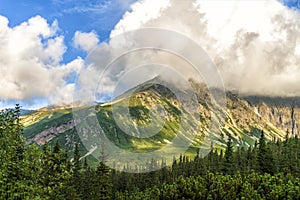 Polish Tatra mountains summer landscape with blue sky and white clouds.