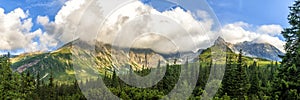 Polish Tatra mountains summer landscape with blue sky and white clouds.