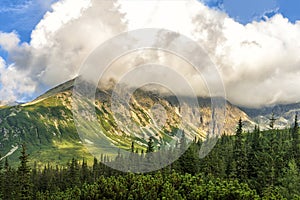 Polish Tatra mountains summer landscape with blue sky and white clouds.