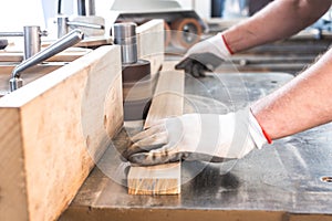 Polish up a board in a carpentry workshop.