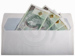 Polish zloty bills in paper envelop isolated on white