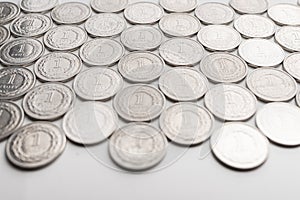 Polish Zloty coins. 1 PLN coin background on the white table