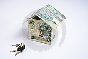 Polish zloty currency, poland money, one hundred zloty copy space, money in the shape of house, keys from home with toy car
