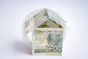 Polish zloty currency, poland money, one hundred zloty copy space, money in the shape of house