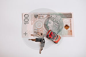 Polish zloty currency, poland money, toy car and keys, one hundred zloty