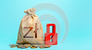 Polish zloty money bag and red padlock. Blocking bank accounts and seizing assets. Cash flow monitoring. Freezing of pension