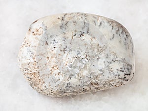 polished Albite gemstone on white