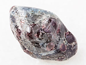 polished Almandine garnet crystals on white marble