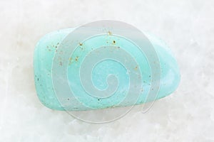 polished Aquamarine gemstone on white marble