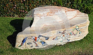 Polished boulder used as a bench in Crescent Bay Point park in North Laguna Beach, California