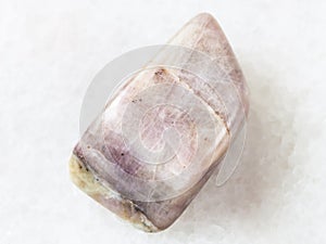polished Cancrinite gemstone on white