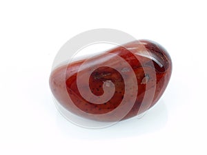 Polished carnelian pebble.