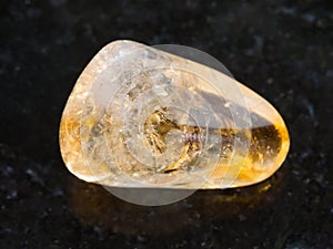 polished Citrine gemstone on dark background