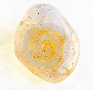 polished Citrine (yellow quartz) gemstone on white