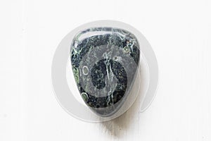 Polished kambaba jasper gemstone on a white background photo