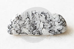 Polished Magnesite rock on white marble