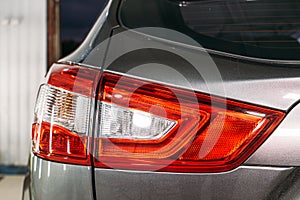 Polished optics of rear lights of car, close up