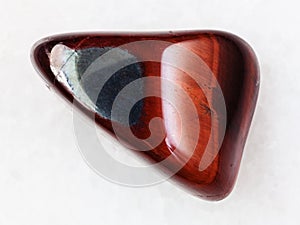 polished Ox's eye gemstone on white