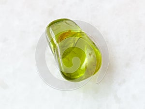 polished Peridot gem stone on white