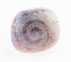 polished pink rhodonite stone on white