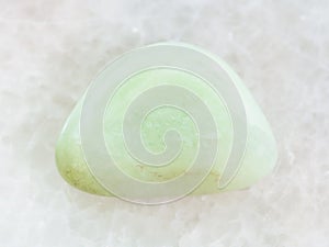 polished Prasiolite gemstone on white marble