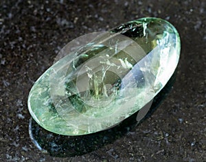 polished Prasiolite (green quartz) rock on black