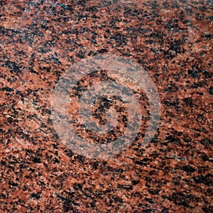 Polished red granite tileable background