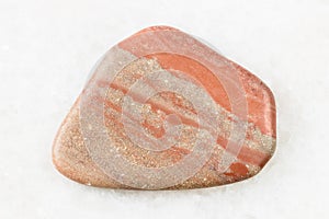 Polished Siltstone Aleurite rock on white marble
