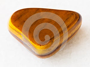 polished tiger-eye gem stone on white