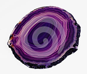 Polished translucent slice of banded purple agate photo