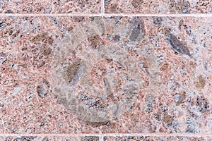 Polished volcanic basalt stone wall as texture