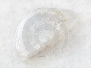 polished white moonstone (adularia) gem on white