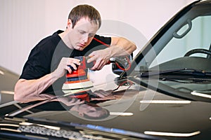 Polishing the car body at the service station.